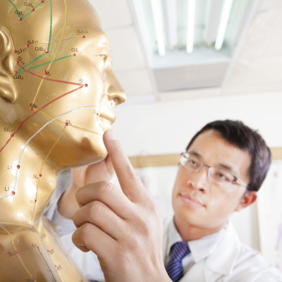 chinese medicine doctor teaching  Acupoint on human model